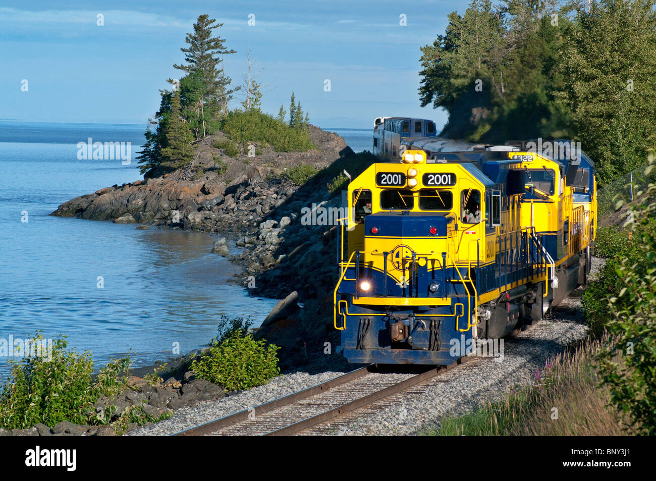 Alaska Railroad train riding along Turnagain Arm in Alaska Stock Photo