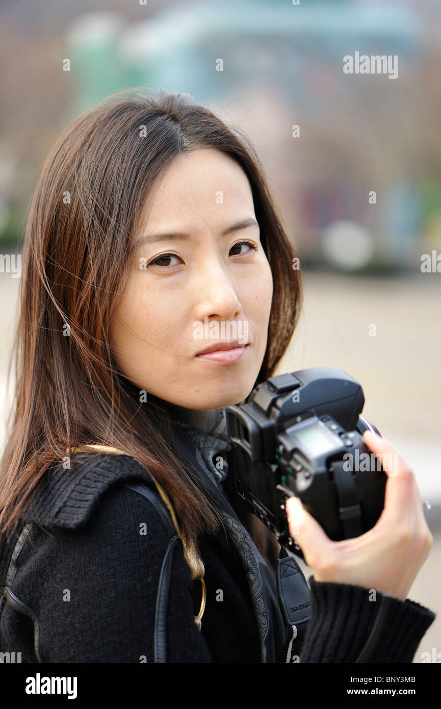 Asian Woman Photographer High Resolution Stock
