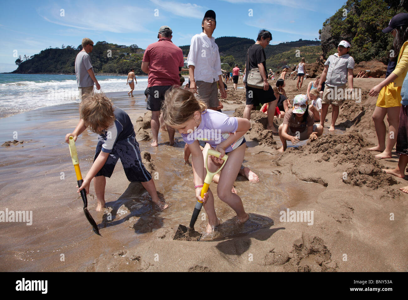 Digging a Hot Pool at Hot Water Beach, Coromandel Peninsula, North