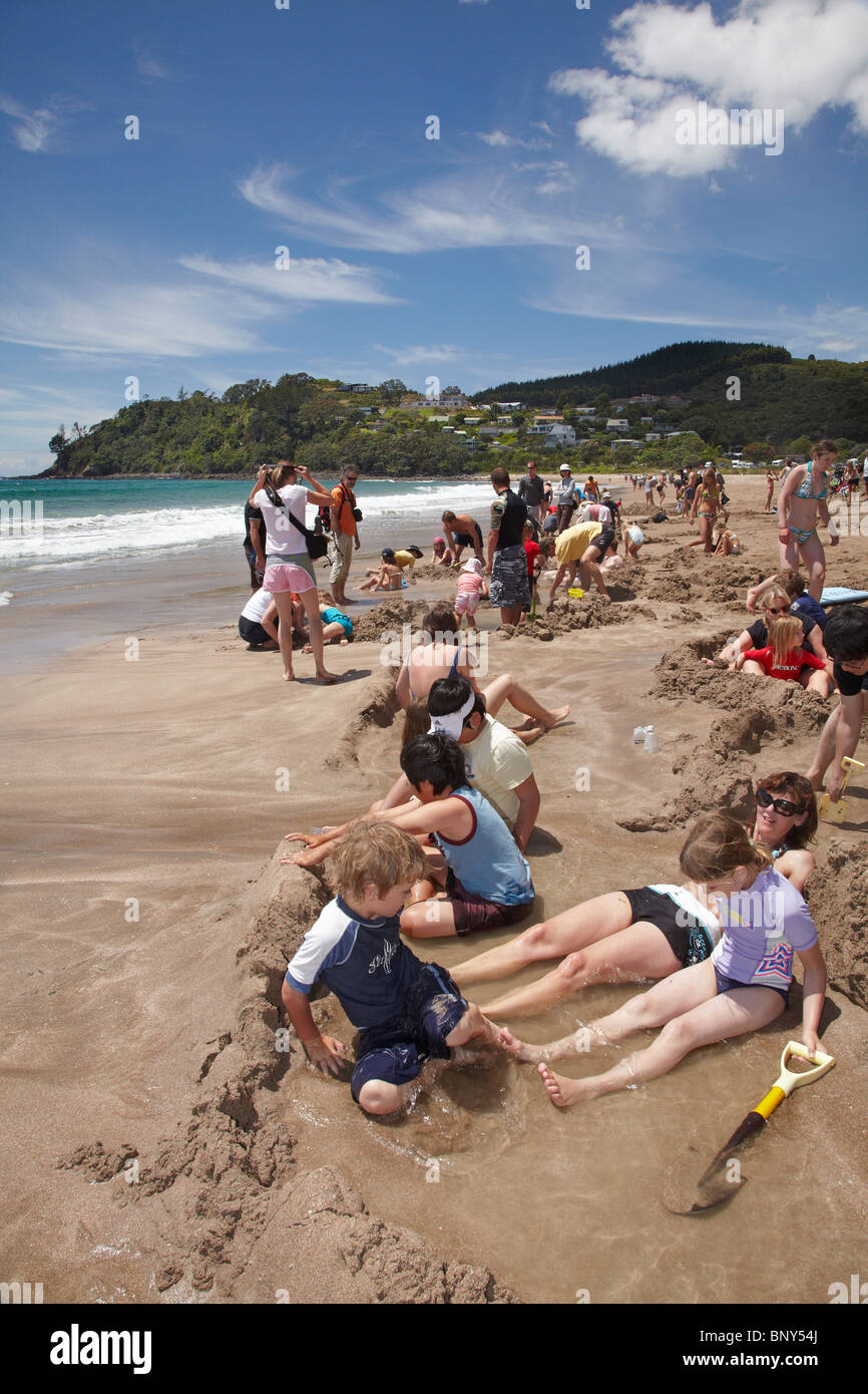 Families Bathing in Hot Pools at Hot Water Beach, Coromandel Peninsula