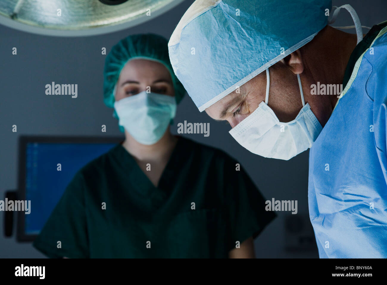 Surgeon focusing on operation Stock Photo