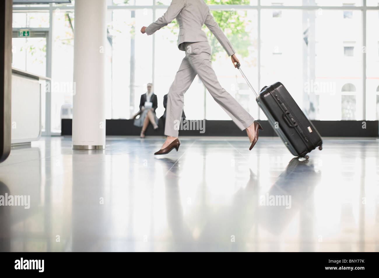 Woman trying to catch her flight Stock Photo Alamy