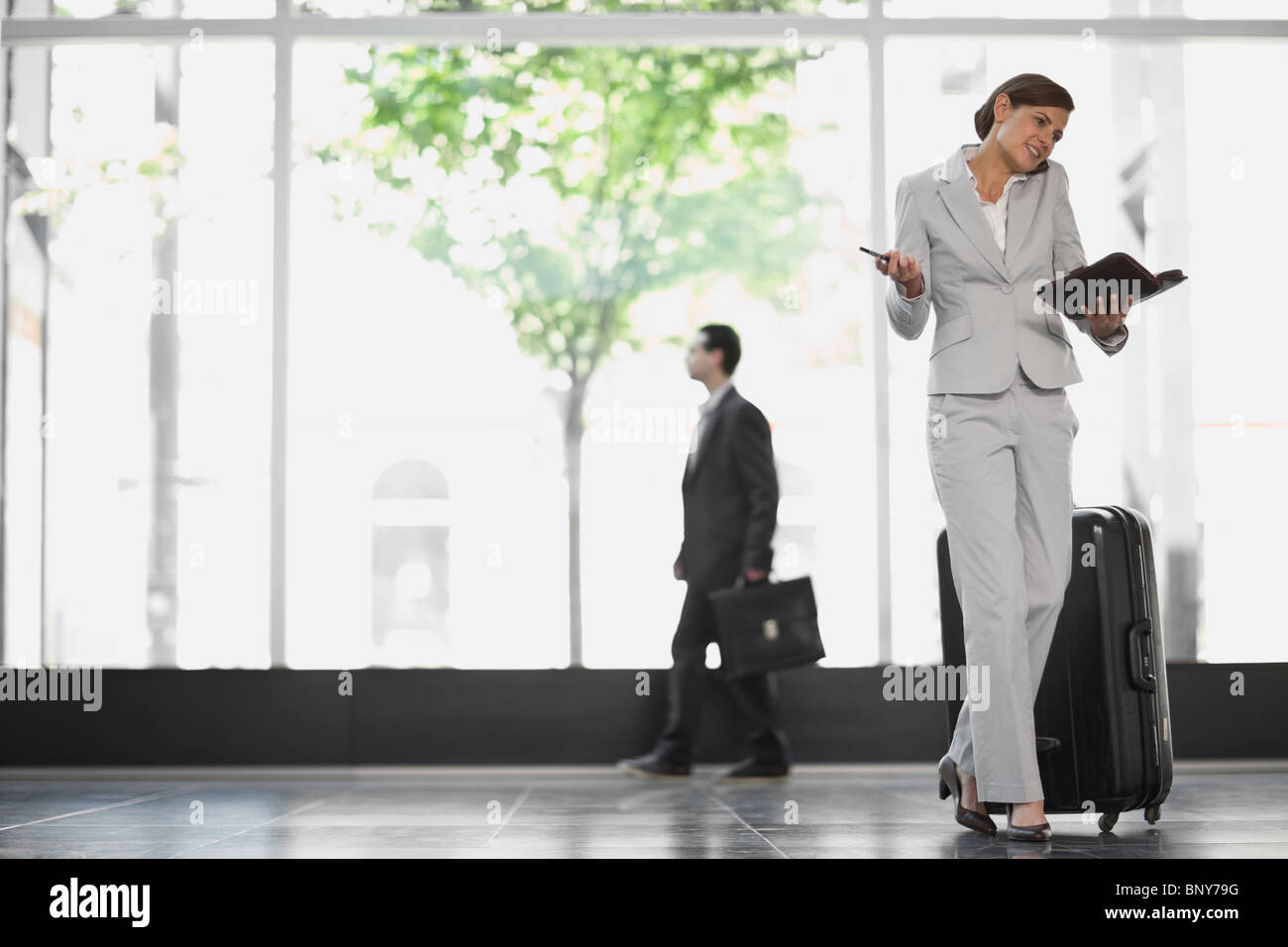 Woman at an airport Stock Photo - Alamy