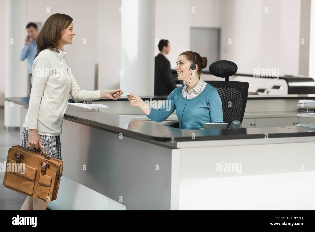 Face to face standing smiling greeting holding communication hires