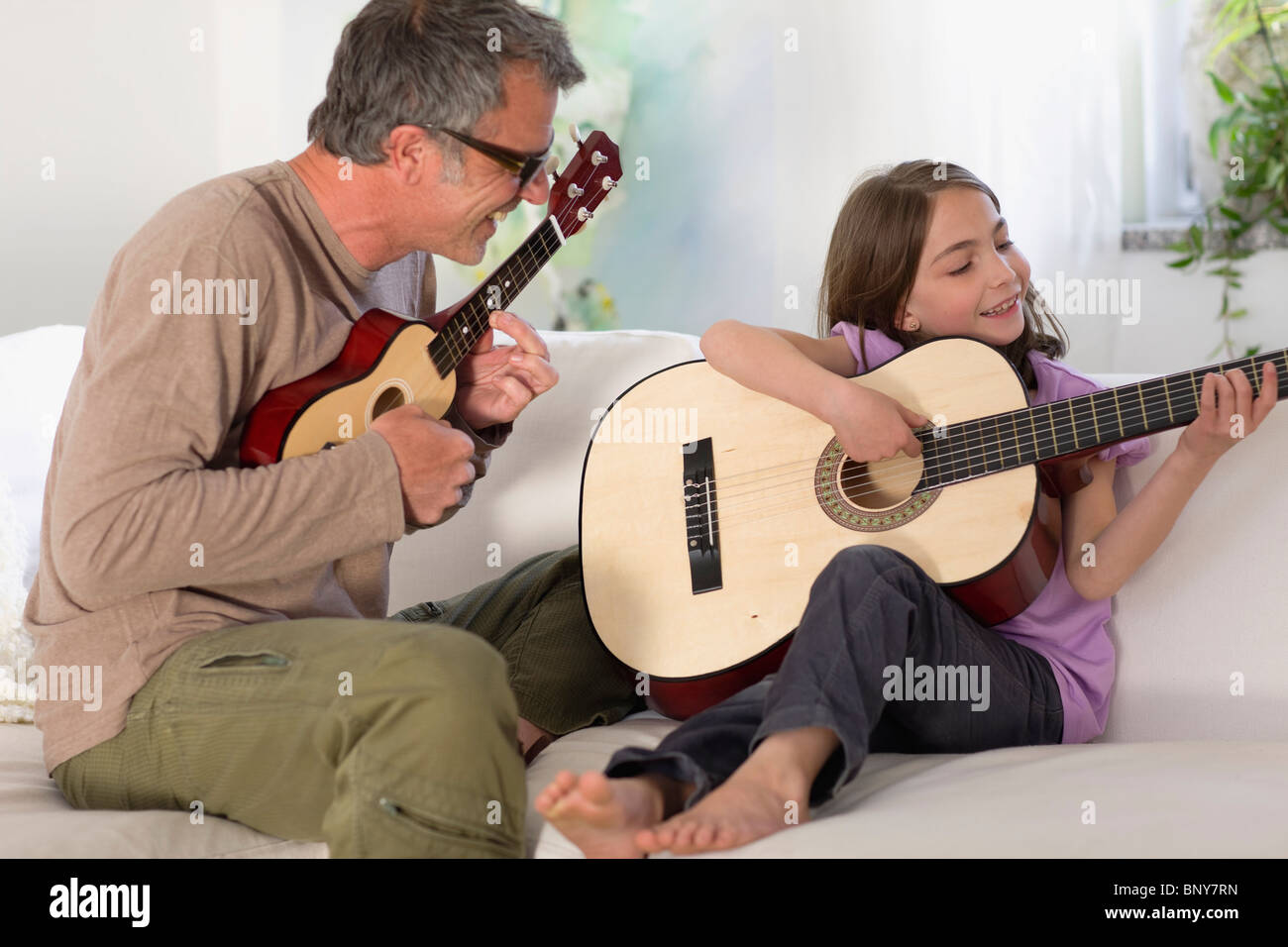Father and daughter making music Stock Photo - Alamy