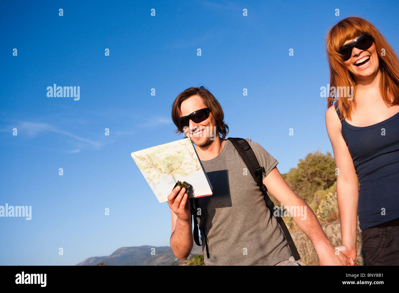 Couple walking hand in hand Stock Photo - Alamy