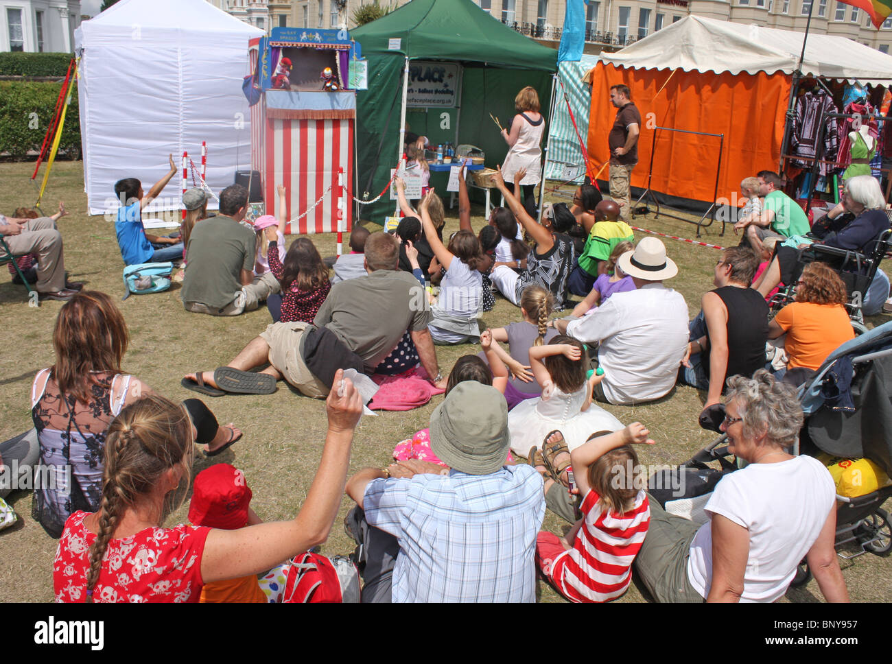 Families watching Punch and Judy show. Stock Photo