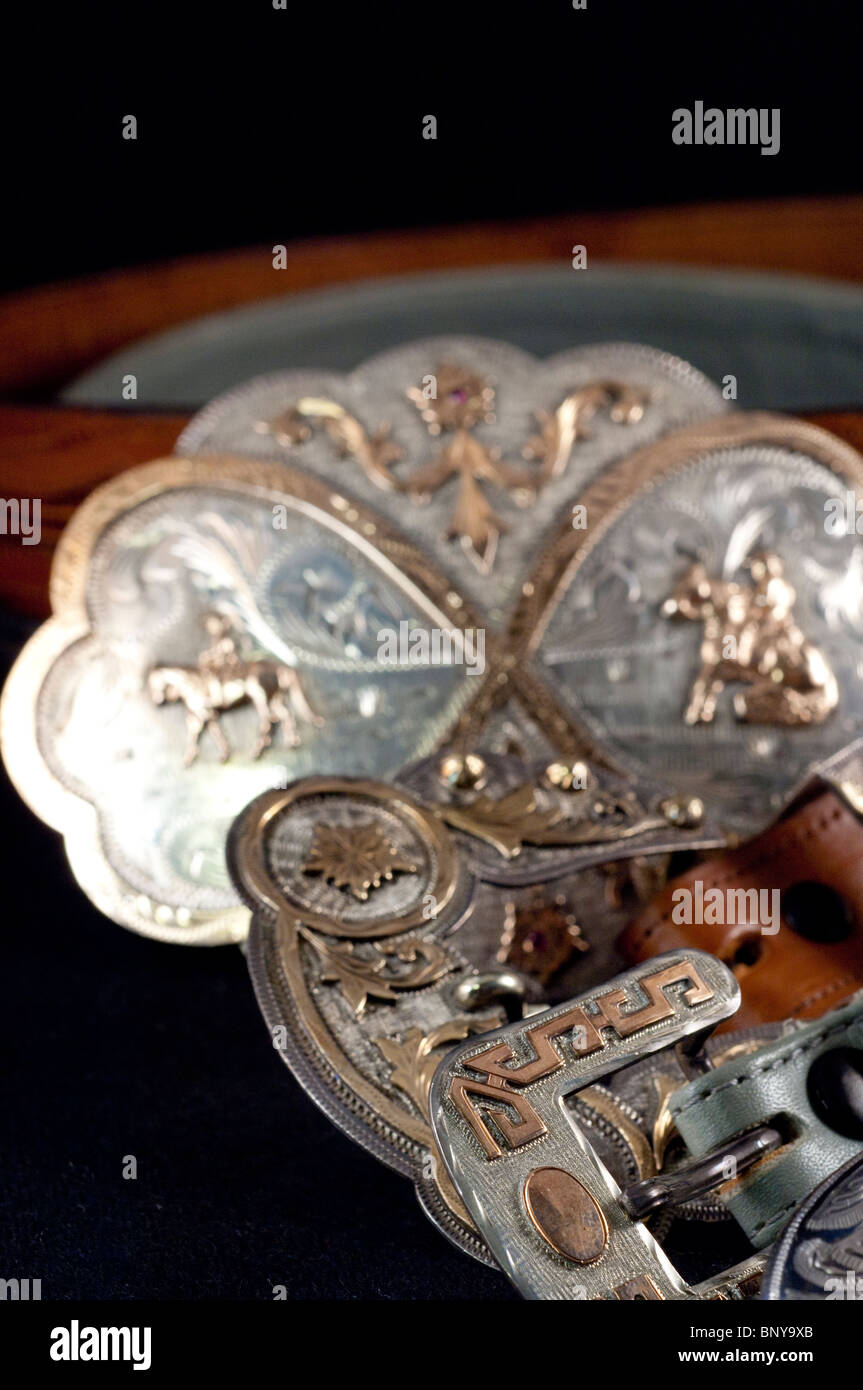 Sterling silver & gold handengraved Western belt buckles on leather