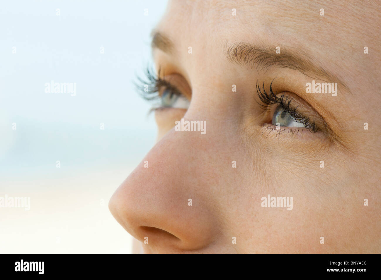 Woman looking up, close-up Stock Photo
