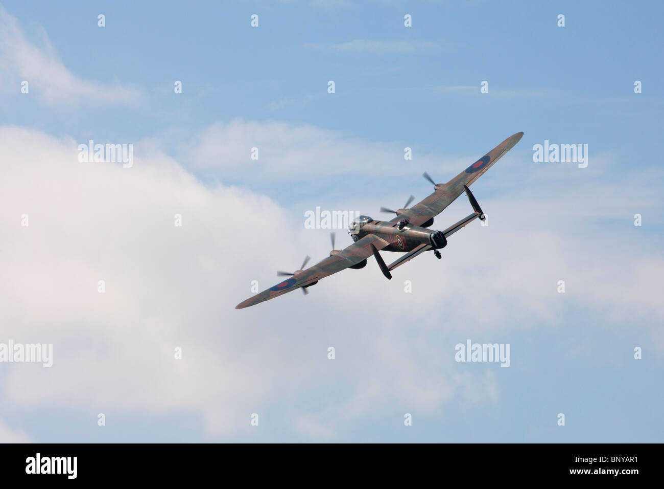 Avro Lancaster B1 PA474 WWII bomber in flight over Wickenby Airfield Stock Photo