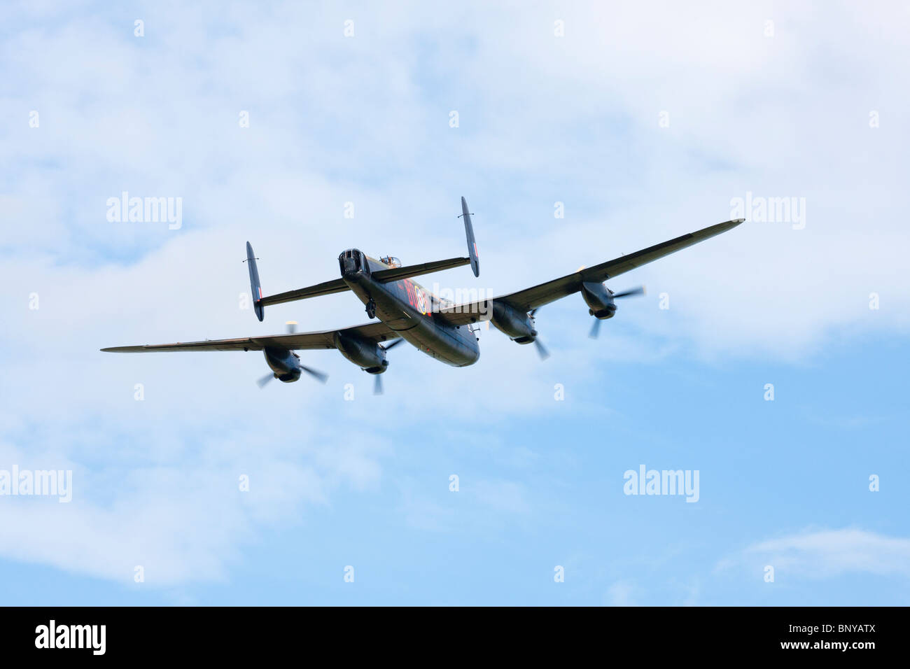 Avro Lancaster B1 PA474 WWII bomber in flight over Wickenby Airfield Stock Photo