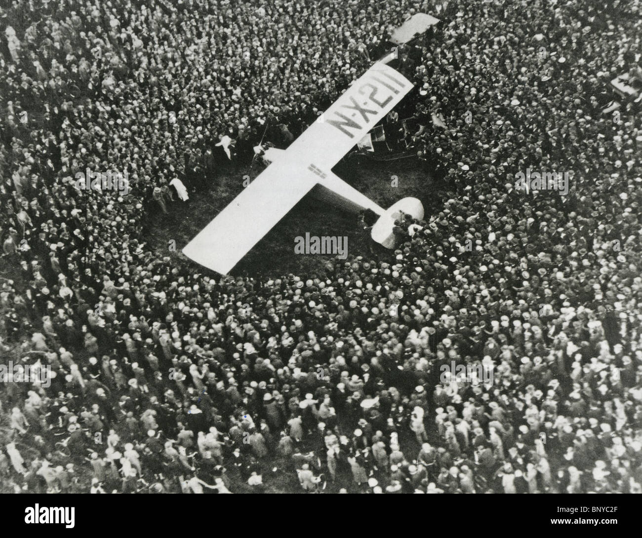 CHARLES LINDBERGH (1902-74) The Spirit of St Louis is surrounded by crowds at Le Bourget  21 May 1927. See Description below Stock Photo