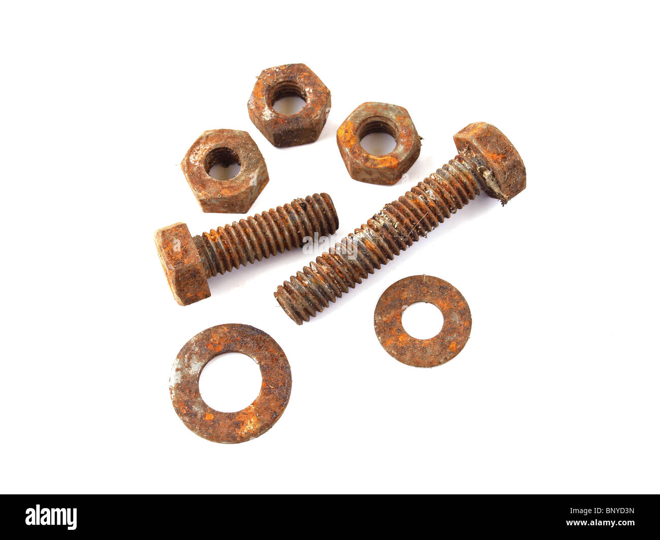 Rusty nuts and bolts on a plain white background. Stock Photo