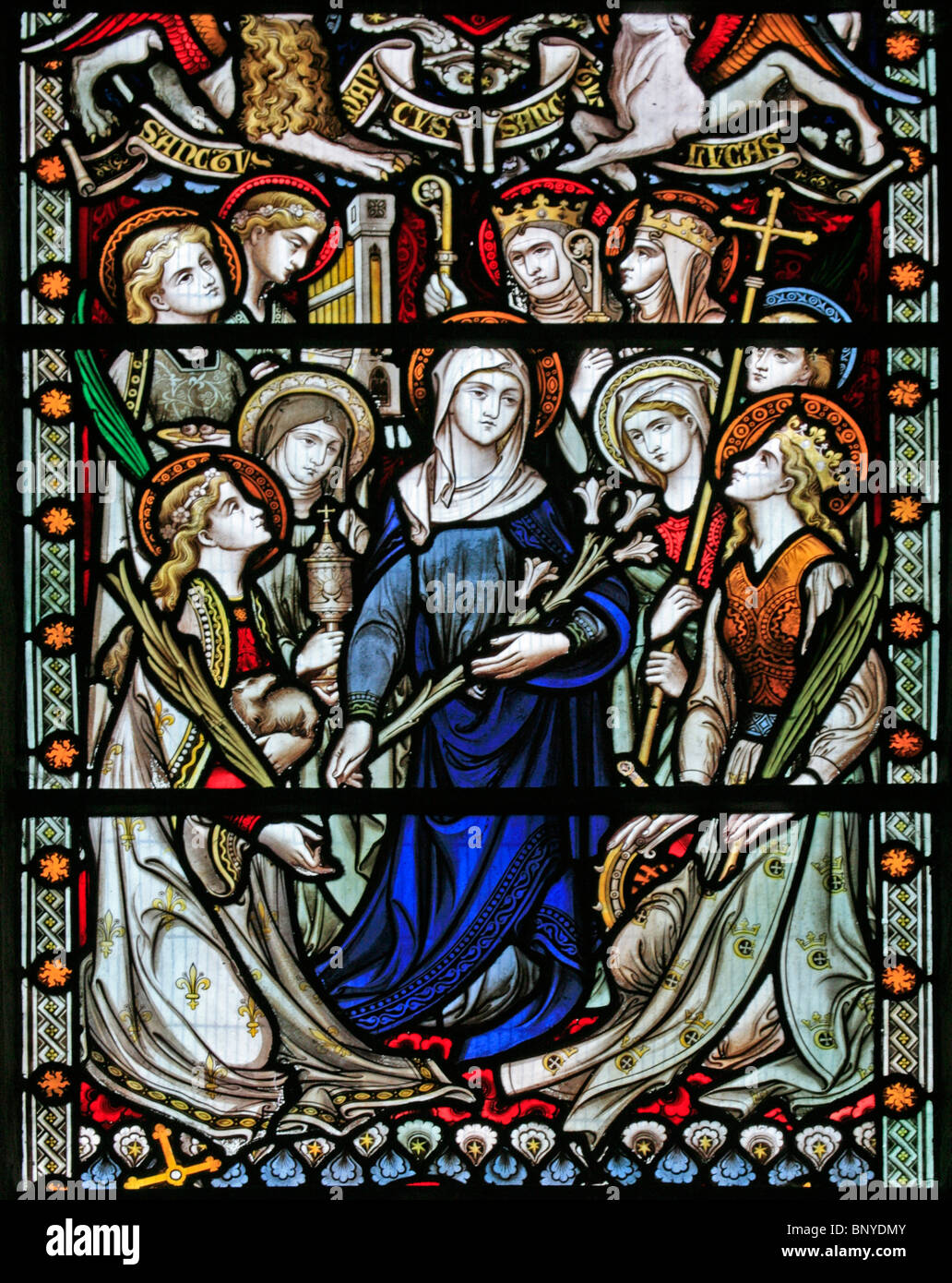 A stained glass window depicting the Virgin Mary surrounded by female saints, All Saints Church, Ladbroke, Warwickshire Stock Photo