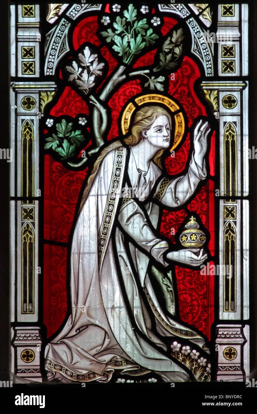 A stained glass window depicting Mary Magdalene holding a jar of ointment, All Saints Church, Ladbroke, Warwickshire Stock Photo