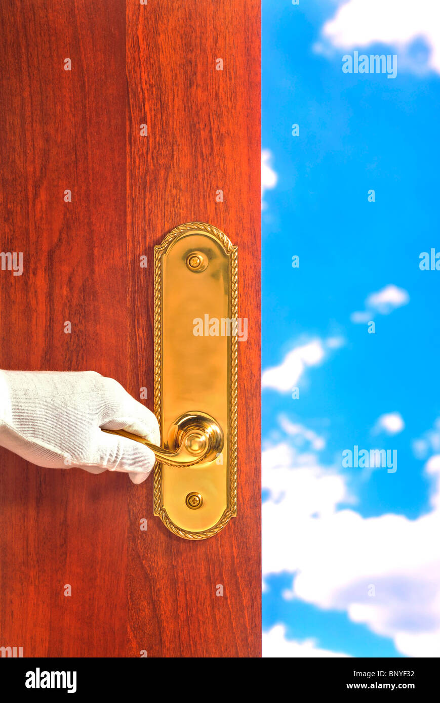 Elegant door being opened to the sky; white glove, butler service Stock