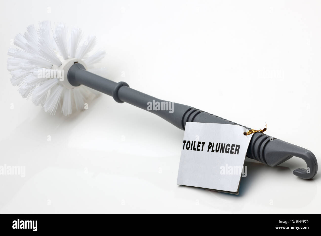 Grey plastic toilet plunger brush Stock Photo