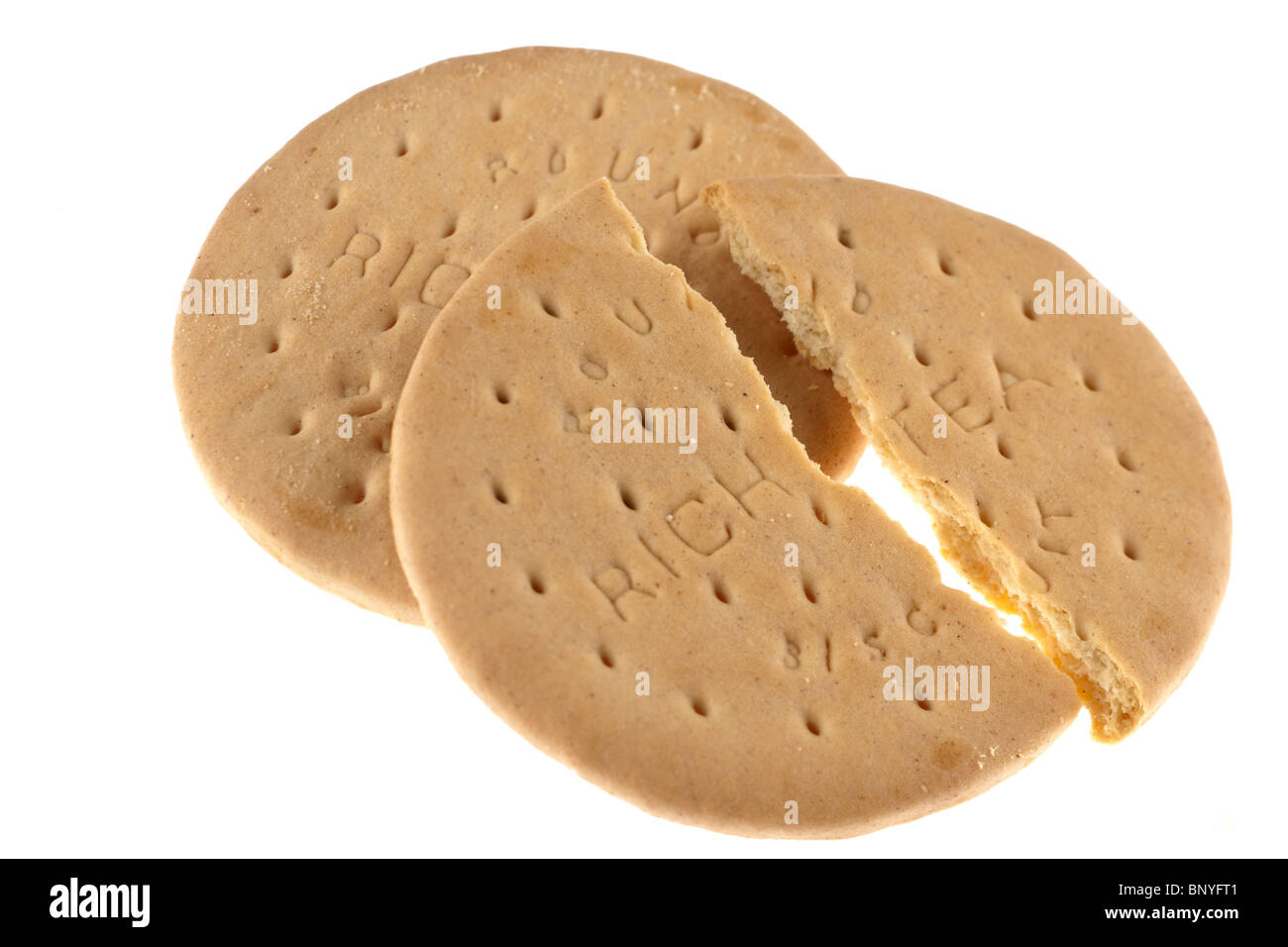 Two rich tea biscuits one halved broken into two pieces Stock Photo