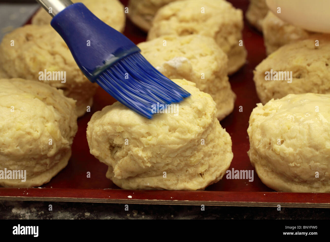 brushing on the glaze Stock Photo Alamy
