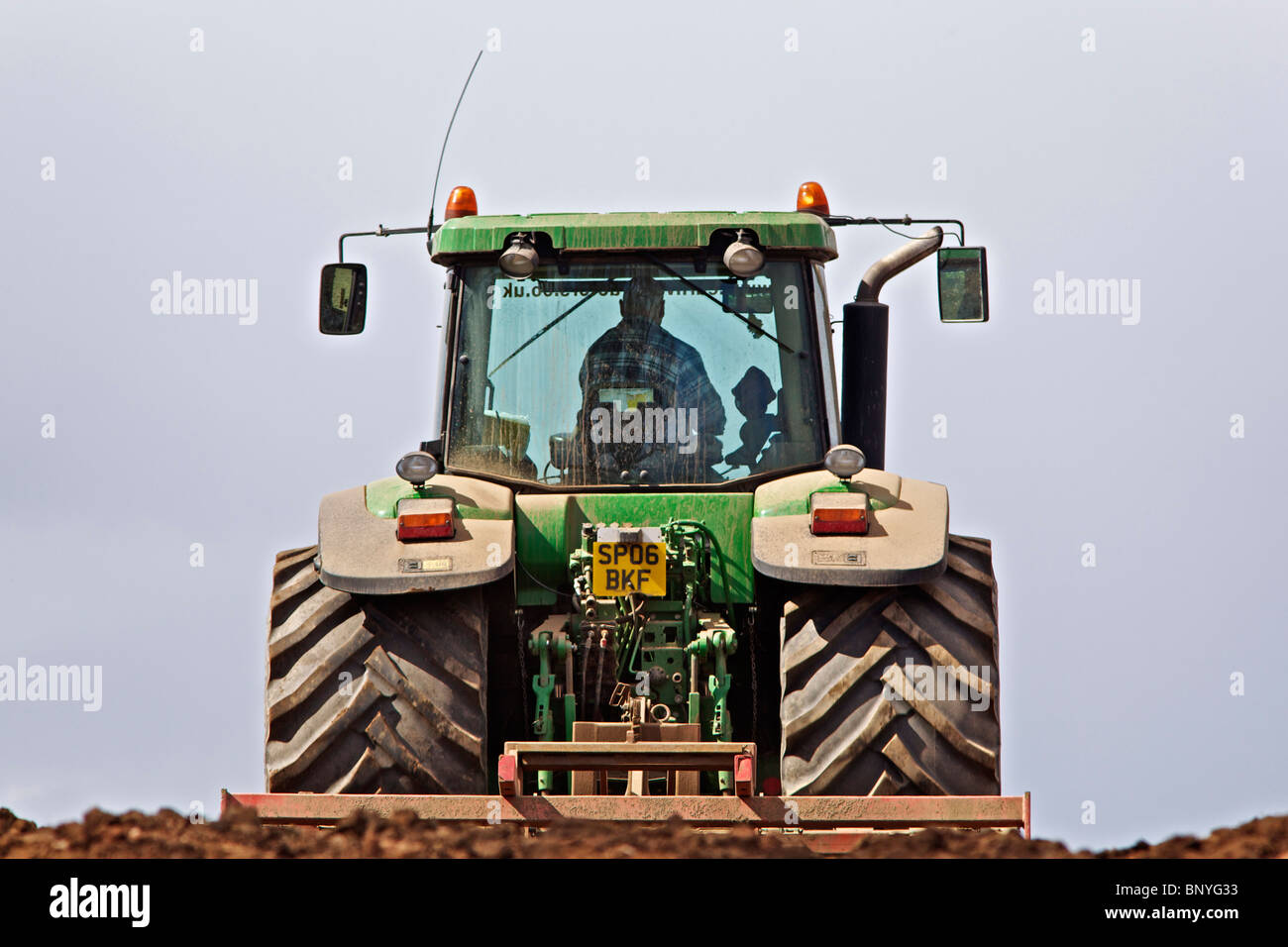 John deere tractor harrowing field hi-res stock photography and images ...