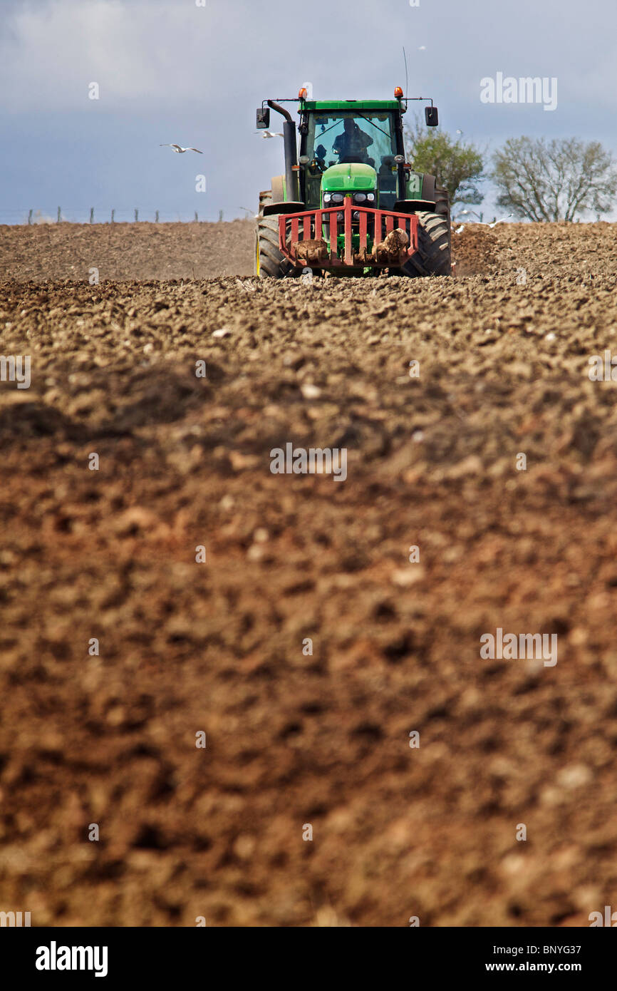 John Deere tractor harrowing a field in Perthshire Stock Photo - Alamy
