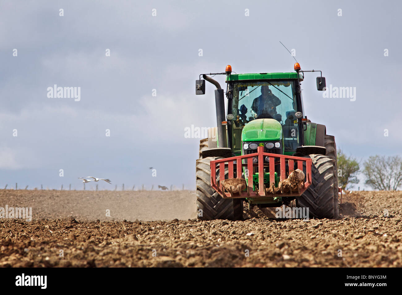 John Deere tractor harrowing a field in Perthshire Stock Photo - Alamy