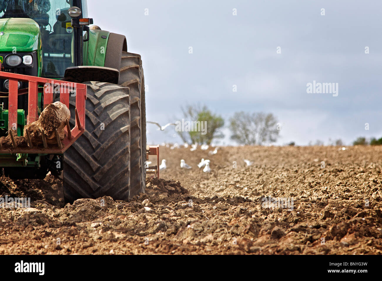 John Deere tractor harrowing a field in Perthshire Stock Photo - Alamy