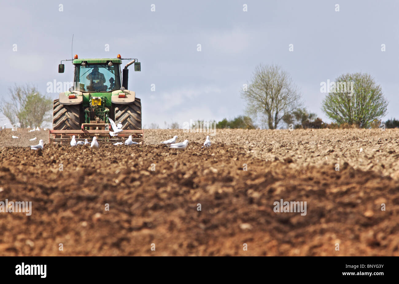 John Deere tractor harrowing a field in Perthshire Stock Photo - Alamy
