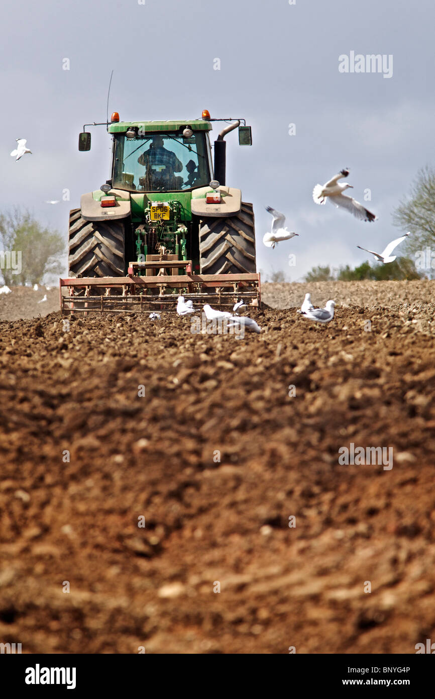 John Deere tractor harrowing a field in Perthshire Stock Photo - Alamy