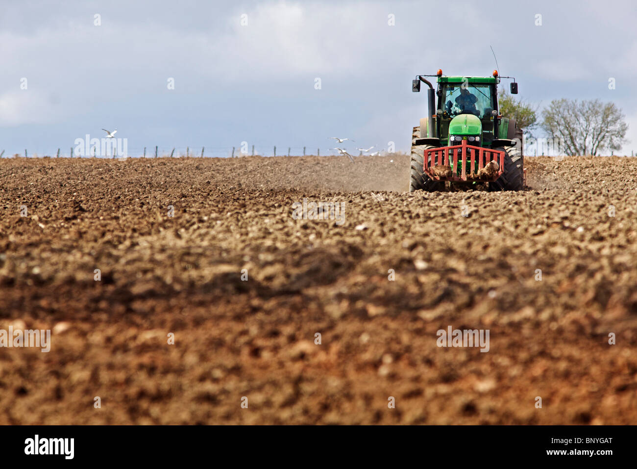 John Deere tractor harrowing a field in Perthshire Stock Photo - Alamy