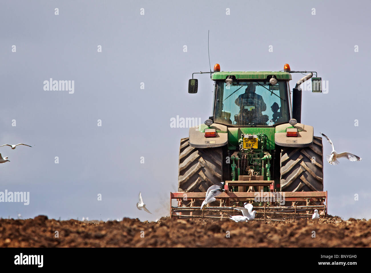 John Deere tractor harrowing a field in Perthshire Stock Photo - Alamy