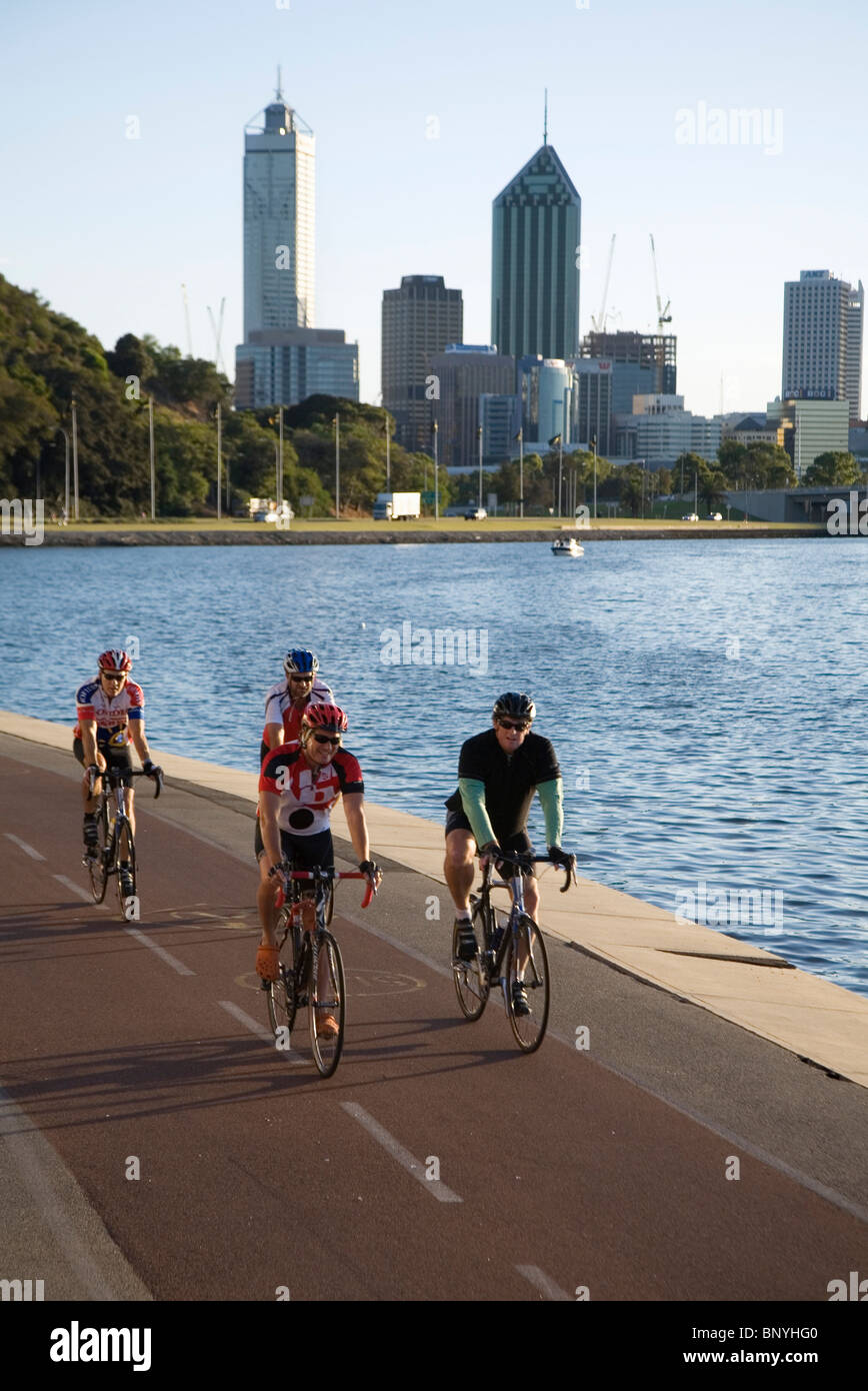 Early morning cyclists on the Perth riverside. Perth, Western Australia, AUSTRALIA. Stock Photo