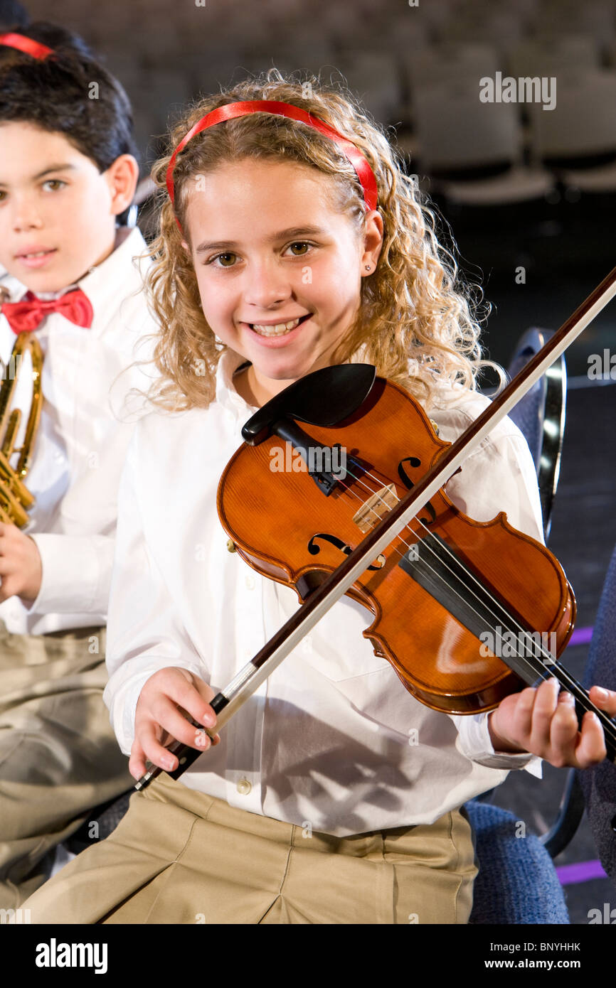 Pupils playing musical instruments in hires stock photography and