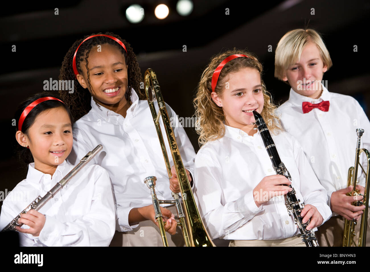 School children playing musical instruments in band Stock Photo Alamy