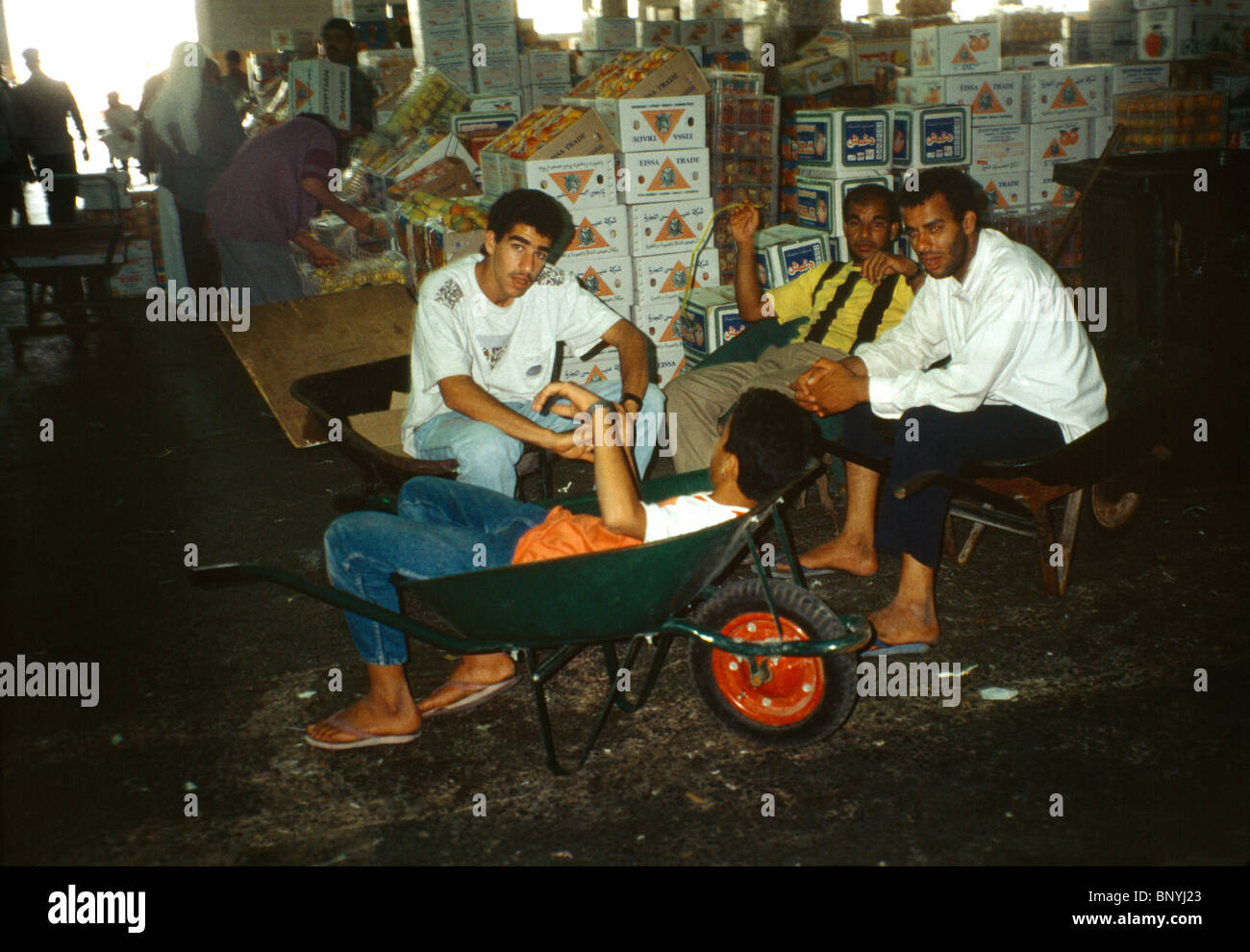 Manama Bahrain Fruit Market Group Of Men Talking One Sitting In A