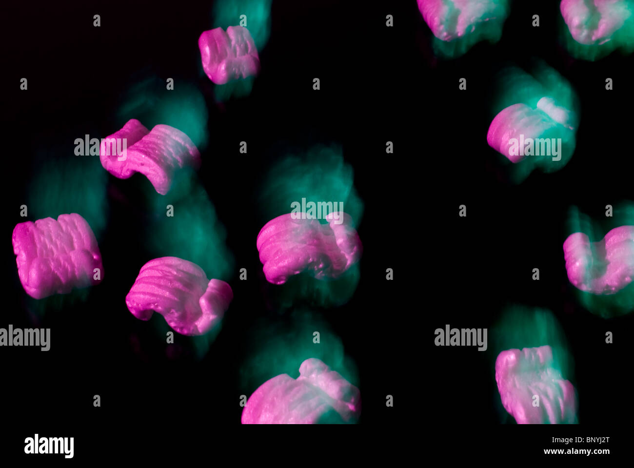 Styrofoam packaging peanuts in motion Stock Photo - Alamy