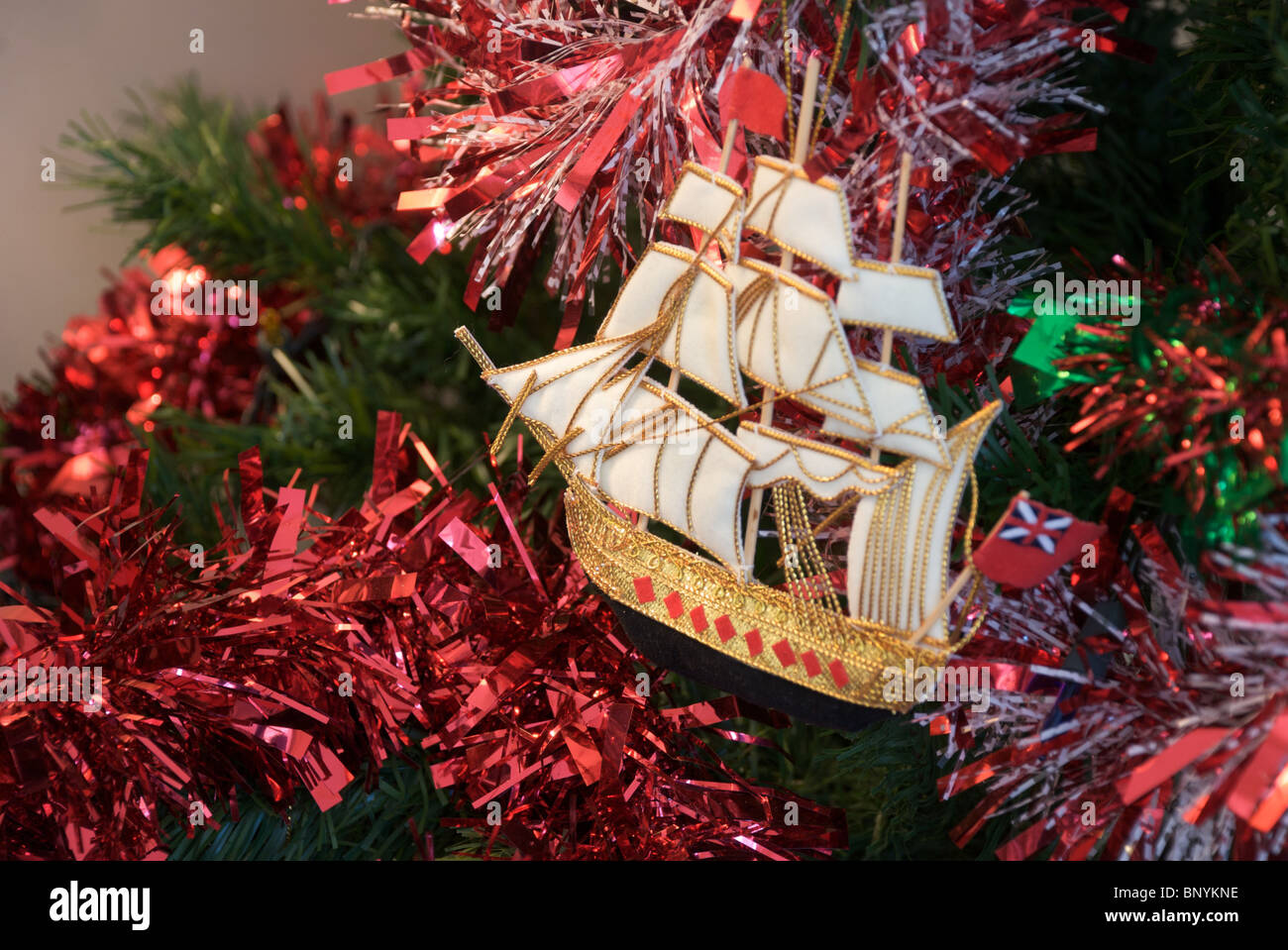 Nelsonian style ship decoration on Christmas tree with red and white