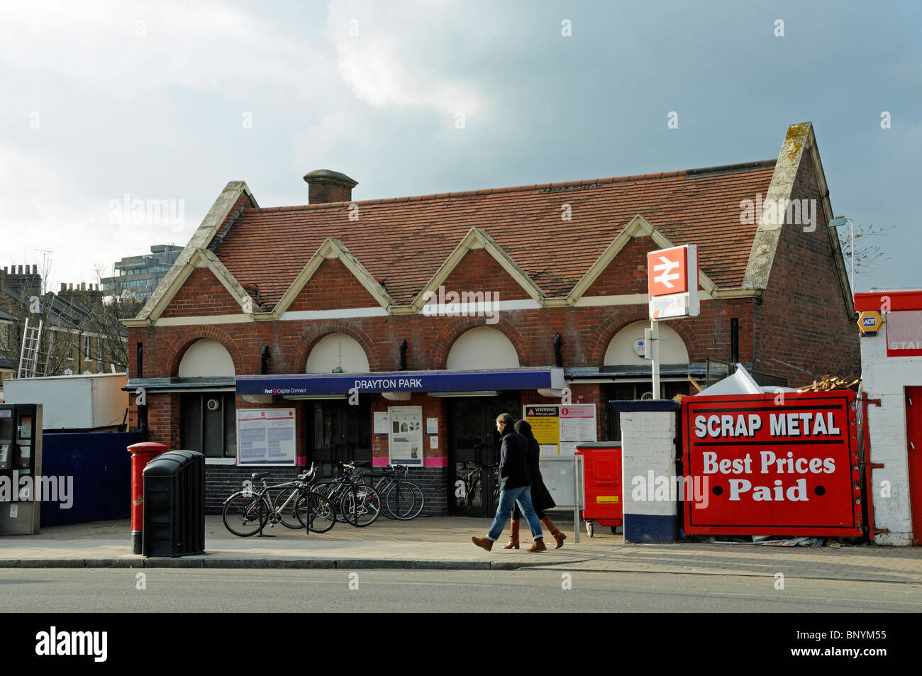 People passing Drayton Park Station Highbury Islington London England