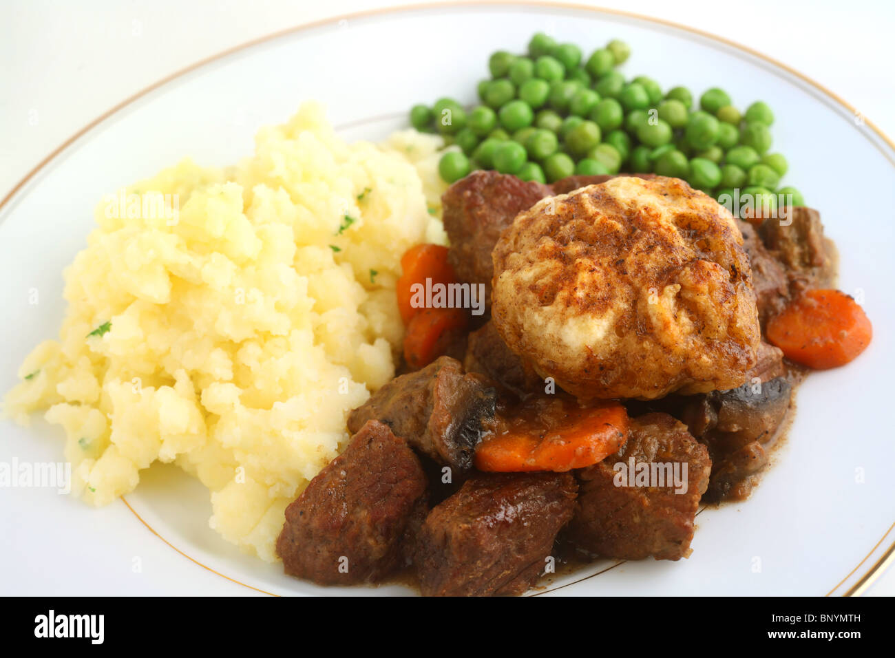 Traditional British beef stew topped with dumplings and served with