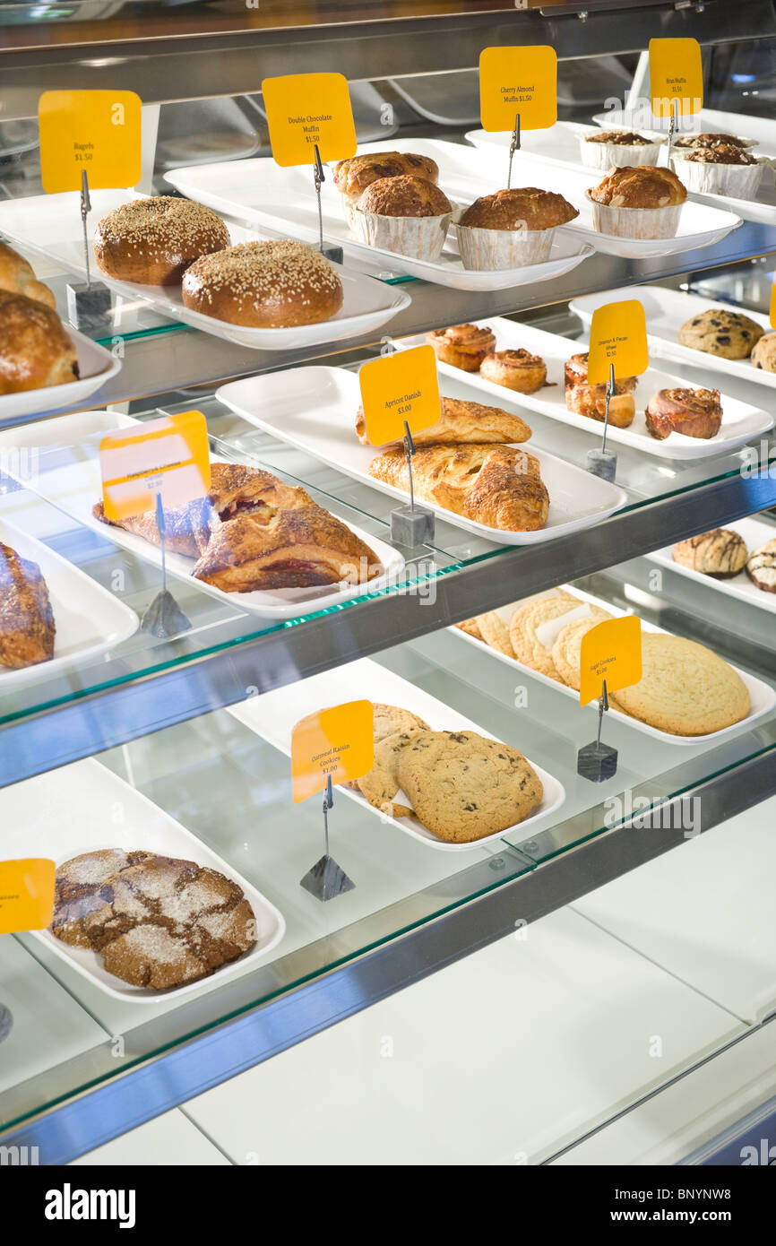 Pastries for sale in bakery display case Stock Photo