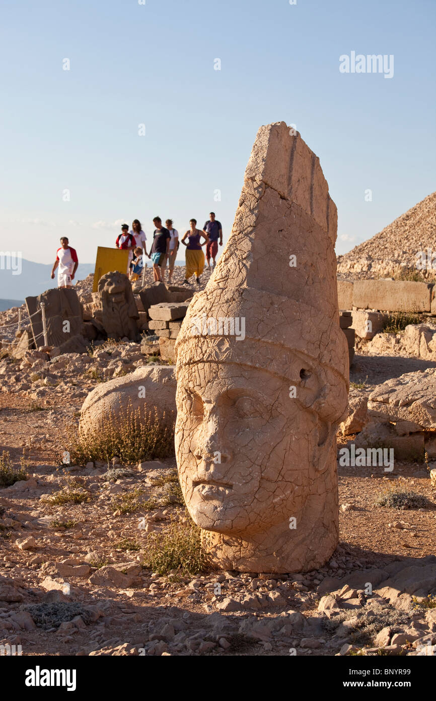 Head of Antiochus, tourists at Mount Nimrut in Turkey Stock Photo