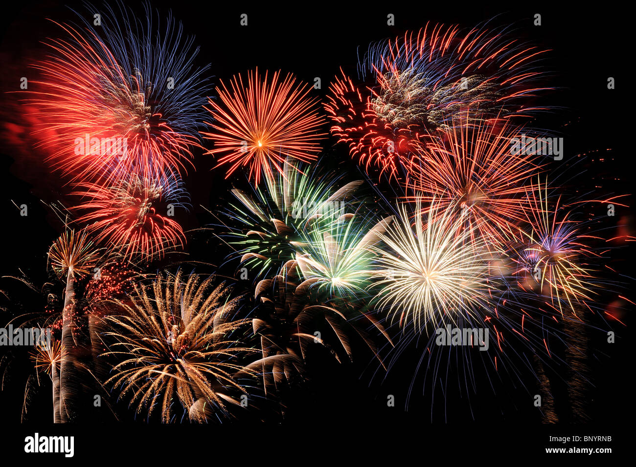 Bright and colorful fireworks exploding in the night sky Stock Photo