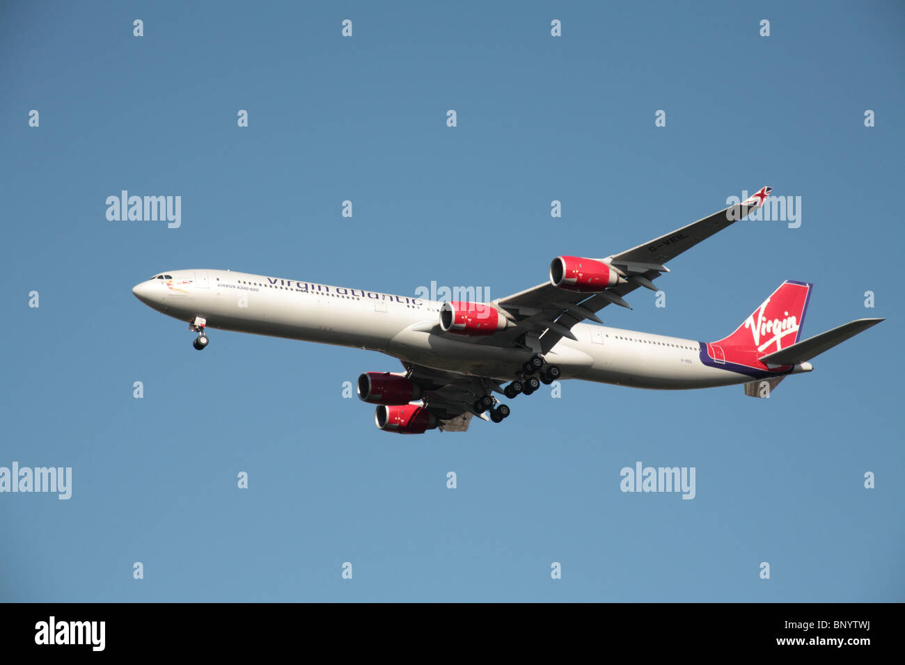 Virgin Atlantic Airbus A340-600 on final approach to Heathrow Airport Stock Photo