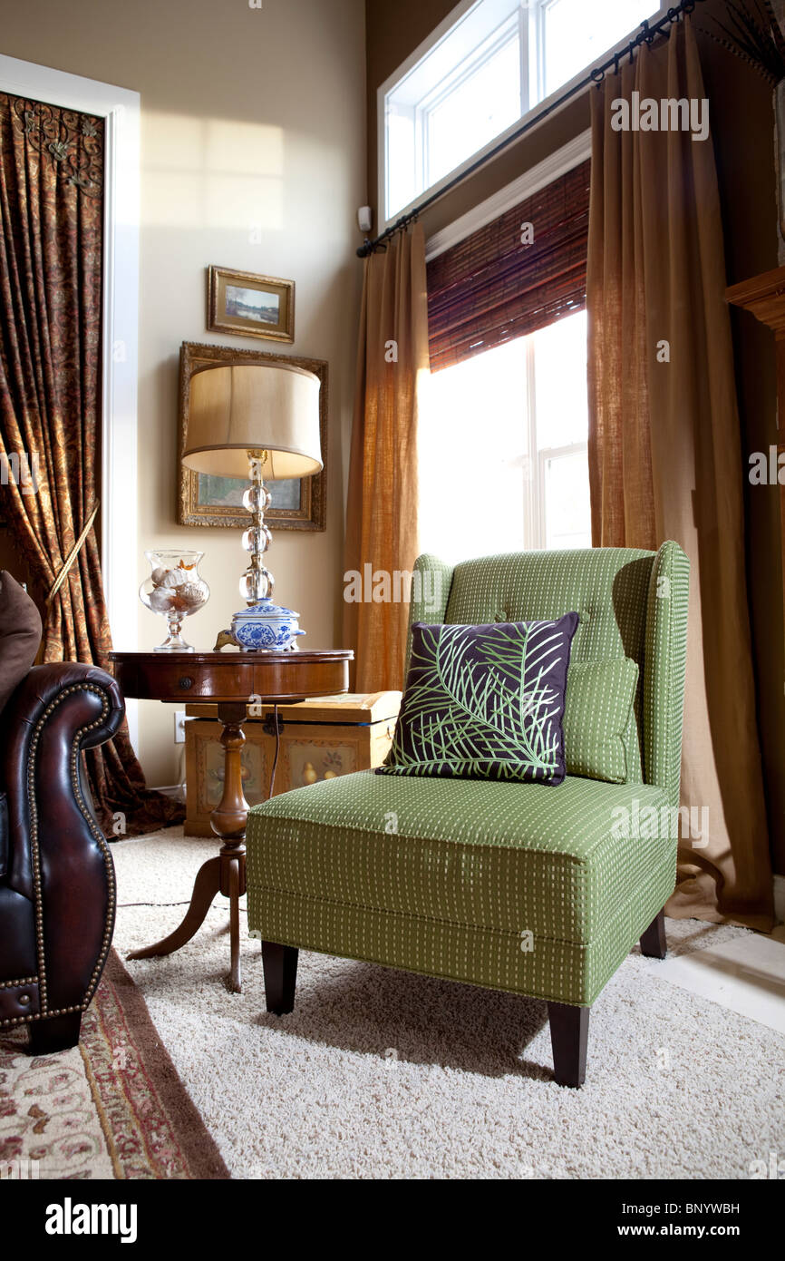 Apple green armchair in sitting room Stock Photo