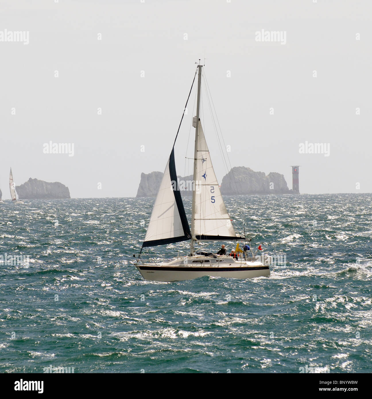 Sailing boat South Channel of The Solent in choppy waters off the Isle