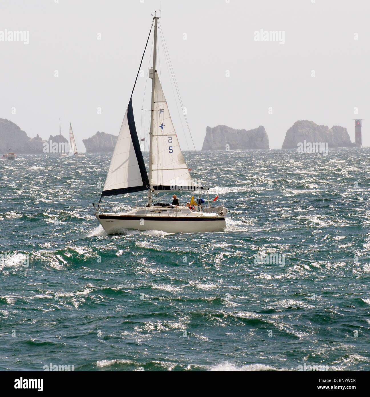 Sailing boat South Channel of The Solent in choppy waters off the Isle