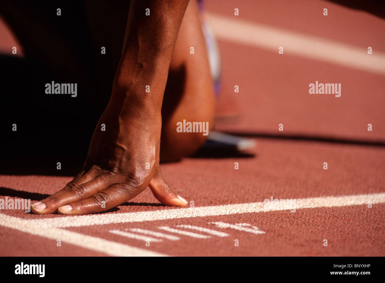 Detail of sprinter hand at the starting line. Stock Photo