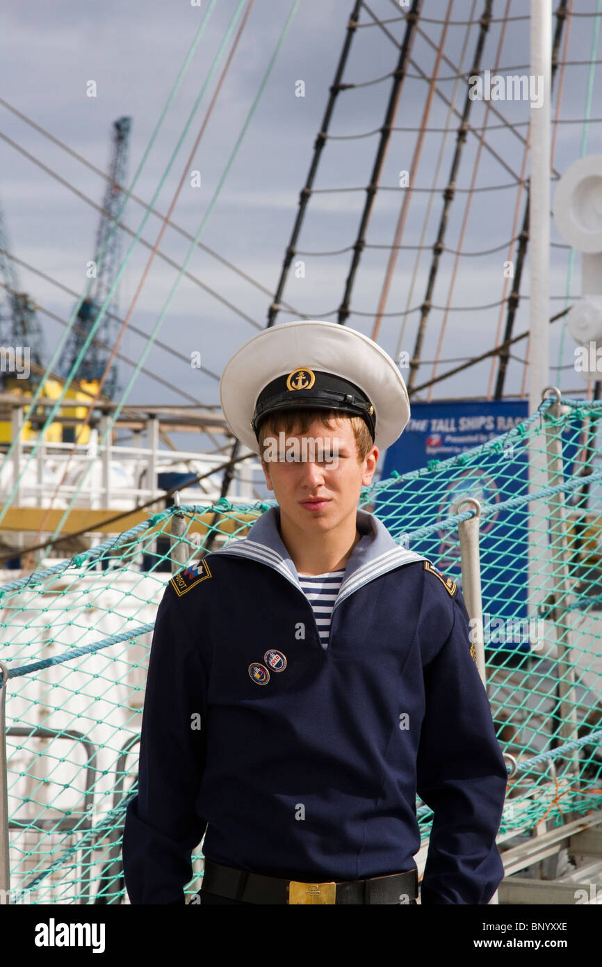 Russian sailor on the STS Mir is a three-masted, full-rigged training ship, based in St. Petersburg, Russia. It was built in 1987 at the Lenin Shipyard in Gdańsk, Poland. Mir is the second largest of six sister ships designed by Polish naval architect Zygmunt Choreń and weighs 2,385 tonnes. Stock Photo