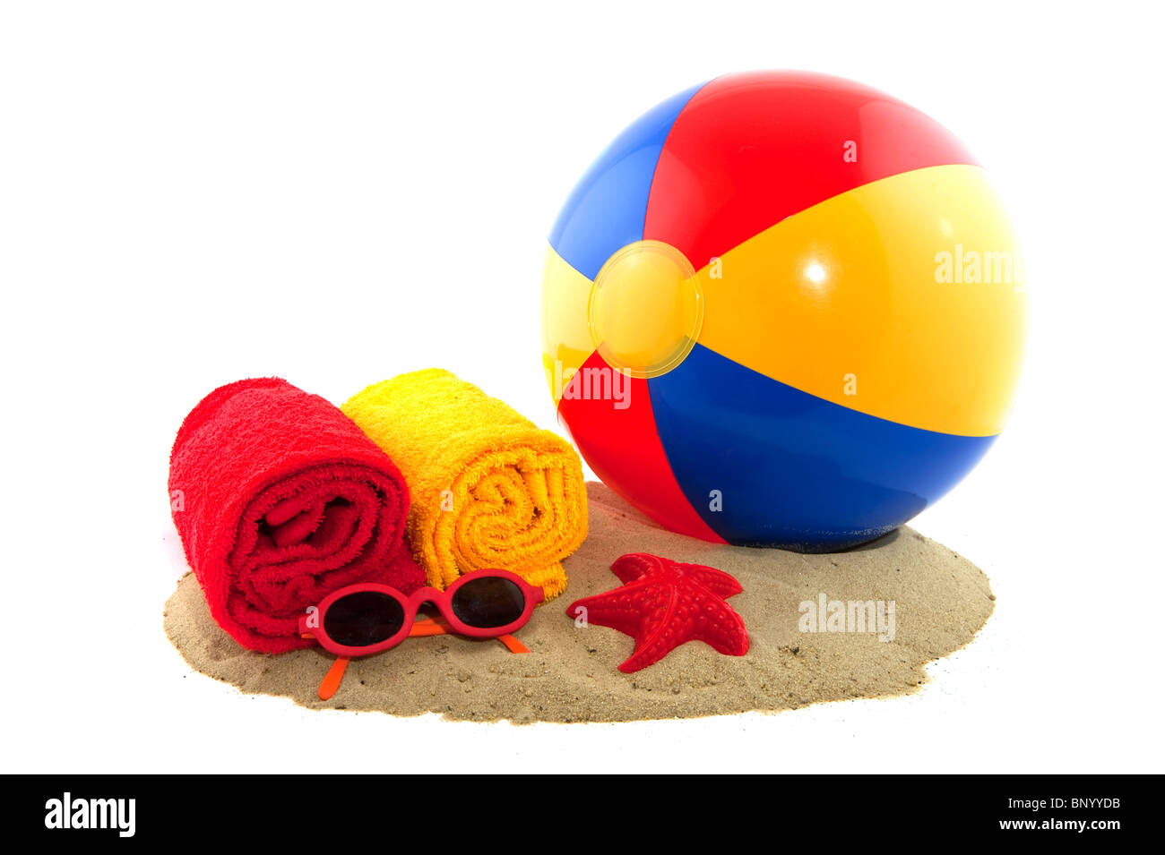 Plastic colorful ball in the sand for on the beach Stock Photo