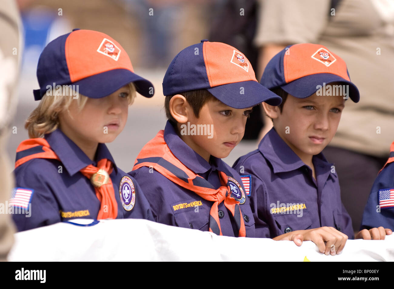 Three boy scouts holding up a banner at the La Habra Corn Festival parade Stock Photo